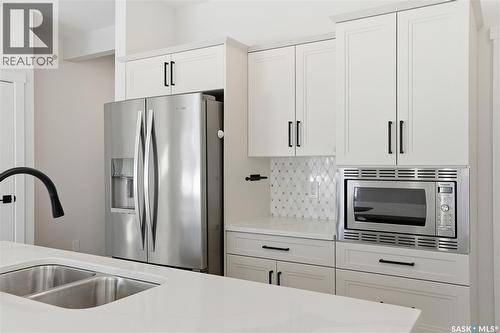134 Chelsom Bend, Saskatoon, SK - Indoor Photo Showing Kitchen With Double Sink