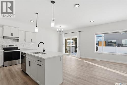 134 Chelsom Bend, Saskatoon, SK - Indoor Photo Showing Kitchen With Double Sink With Upgraded Kitchen