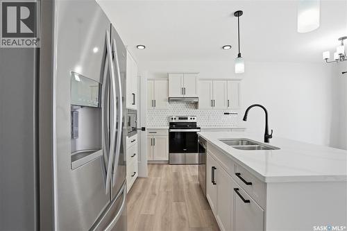 134 Chelsom Bend, Saskatoon, SK - Indoor Photo Showing Kitchen With Double Sink With Upgraded Kitchen