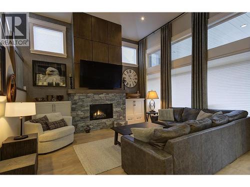 5499 Mountainside Drive, Kelowna, BC - Indoor Photo Showing Living Room With Fireplace