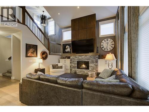 5499 Mountainside Drive, Kelowna, BC - Indoor Photo Showing Living Room With Fireplace