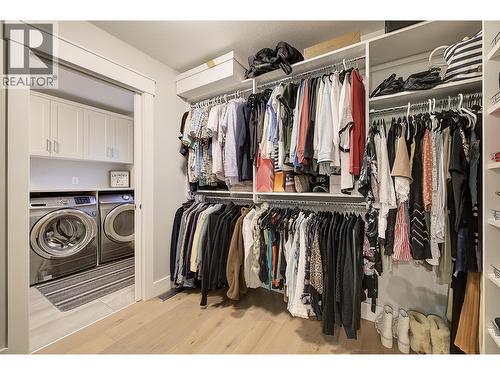 walk through closet from ensuite to laundry - 5499 Mountainside Drive, Kelowna, BC - Indoor With Storage