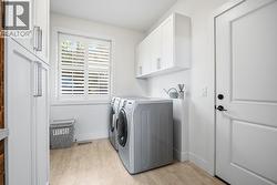 Laundry room with lots of cabinets available on upper level - 