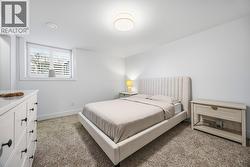 Fourth bedroom with a walk in closet on the lower level - 