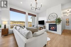 Elevated ceilings flood the living space with West-facing light as you enter - 