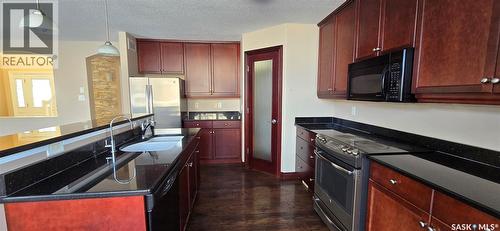 2523 Broderick Road, Regina, SK - Indoor Photo Showing Kitchen With Double Sink