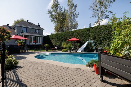 Face arrière - 259 Rue Des Plaines, Les Coteaux, QC - Outdoor With In Ground Pool