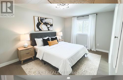 Virtually Staged Primary Bedroom - #130 - 63 Whites Road, Quinte West (Sidney Ward), ON - Indoor Photo Showing Bedroom