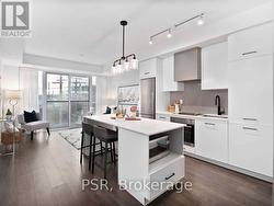 406 - 899 QUEEN STREET E  Toronto, ON M4M 1J4