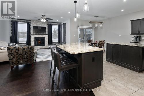 70 Kenton Street, West Perth (Mitchell), ON - Indoor Photo Showing Kitchen With Fireplace With Upgraded Kitchen