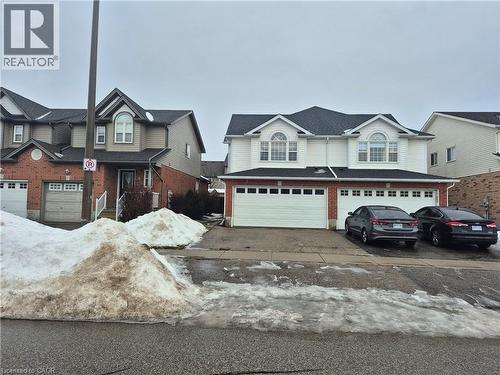 View of front of property with an attached garage, driveway, and roof with shingles - 10 Donnenwerth Drive, Kitchener, ON - Outdoor With Facade