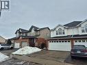 View of front of home with asphalt driveway and brick siding - 10 Donnenwerth Drive, Kitchener, ON  - Outdoor With Facade 