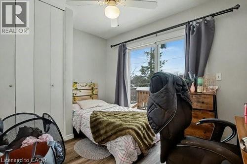main floor bedroom with patio doors leading to deck - 11 Carwyn Crescent, Hamilton, ON - Indoor Photo Showing Bedroom