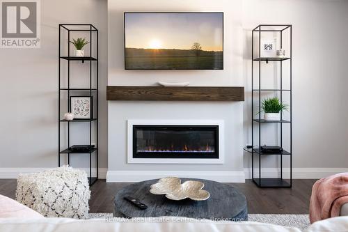 Photo is representation of Builders work - 202 Bridge Crescent, Minto, ON - Indoor Photo Showing Living Room With Fireplace