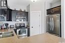 614 150 Langlois Way, Saskatoon, SK  - Indoor Photo Showing Kitchen With Double Sink 