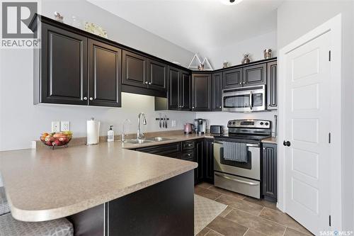 614 150 Langlois Way, Saskatoon, SK - Indoor Photo Showing Kitchen With Double Sink