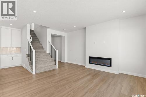 279 Nazarali Way, Saskatoon, SK - Indoor Photo Showing Living Room With Fireplace