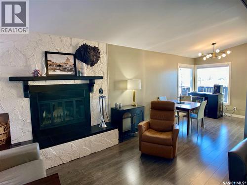91 Moir Drive, Oxbow, SK - Indoor Photo Showing Living Room With Fireplace