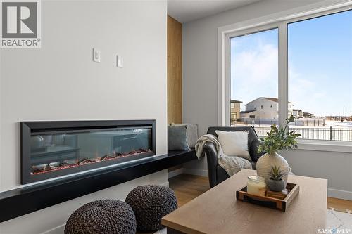 934 Brighton Gate, Saskatoon, SK - Indoor Photo Showing Other Room With Fireplace