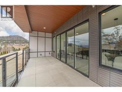 Spacious covered deck with access to green space and walking path - 