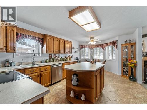 2595 Catherine Place Unit# 15, Armstrong, BC - Indoor Photo Showing Kitchen With Fireplace With Double Sink