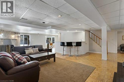 Living area with a dry bar, a drop ceiling, and parquet flooring - 148 Cowan Boulevard, Cambridge, ON - Indoor