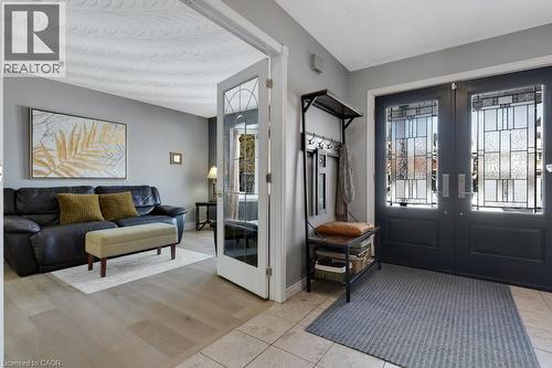 Entrance foyer featuring french doors and light tile patterned flooring - 148 Cowan Boulevard, Cambridge, ON - Indoor