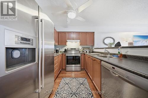 103 - 1450 Bishops Gate, Oakville, ON - Indoor Photo Showing Kitchen With Stainless Steel Kitchen With Double Sink