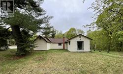 Rear yard with patio doors from Primary BR - 