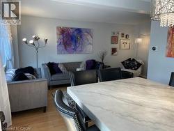 Dining room with light wood-style flooring - 
