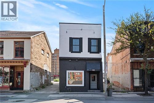 View of front of property with brick siding - 93 John Street S, Hamilton, ON 