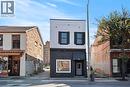View of front of property with brick siding - 93 John Street S, Hamilton, ON 