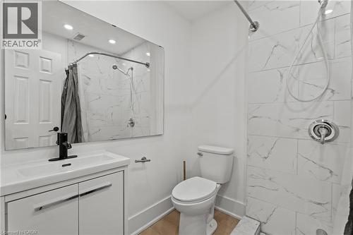 Full bath with vanity, a marble finish shower, and recessed lighting - 93 John Street S, Hamilton, ON 