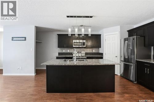 116 125 Willis Crescent, Saskatoon, SK - Indoor Photo Showing Kitchen With Upgraded Kitchen