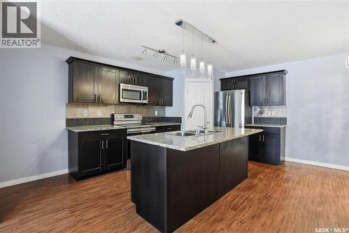 116 125 Willis Crescent, Saskatoon, SK - Indoor Photo Showing Kitchen With Upgraded Kitchen