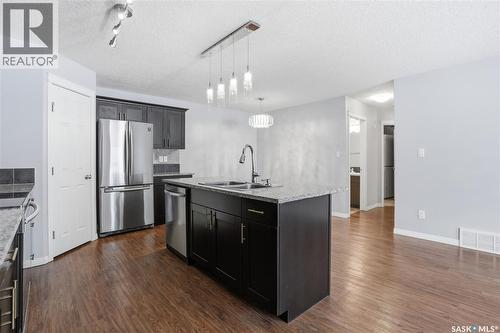 116 125 Willis Crescent, Saskatoon, SK - Indoor Photo Showing Kitchen With Double Sink With Upgraded Kitchen