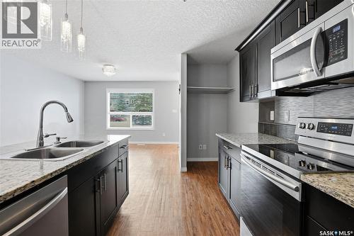 116 125 Willis Crescent, Saskatoon, SK - Indoor Photo Showing Kitchen With Double Sink With Upgraded Kitchen