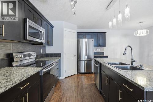 116 125 Willis Crescent, Saskatoon, SK - Indoor Photo Showing Kitchen With Double Sink With Upgraded Kitchen
