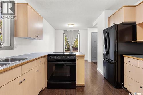 78 Spence Street, Regina, SK - Indoor Photo Showing Kitchen With Double Sink