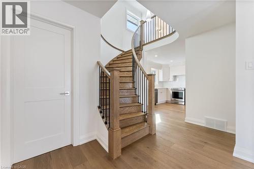 Stairs featuring wood finished floors - 16 Bosna Court, Hamilton, ON - Indoor Photo Showing Other Room