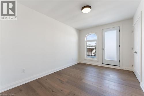 Spare room featuring baseboards and dark wood-style flooring - 16 Bosna Court, Hamilton, ON - Indoor Photo Showing Other Room