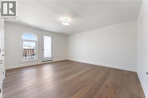 Empty room featuring wood-type flooring - 16 Bosna Court, Hamilton, ON - Indoor Photo Showing Other Room