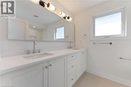 Bathroom featuring double vanity and baseboards - 16 Bosna Court, Hamilton, ON - Indoor Photo Showing Bathroom