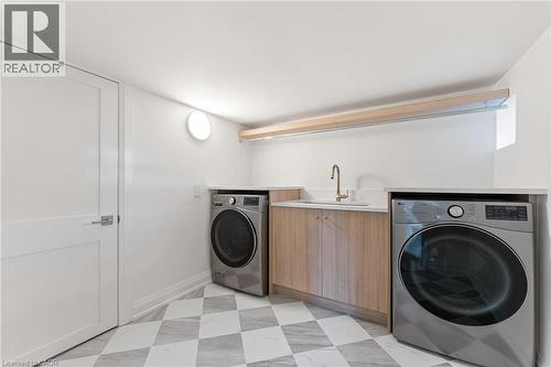 Laundry area with washing machine and dryer and light floors - 16 Bosna Court, Hamilton, ON - Indoor Photo Showing Laundry Room
