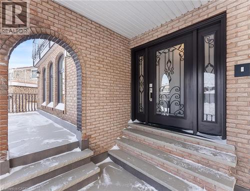 Doorway to property featuring brick siding and covered porch - 16 Bosna Court, Hamilton, ON - Outdoor