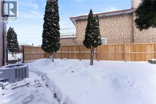 Yard layered in snow featuring a fenced backyard - 16 Bosna Court, Hamilton, ON - Outdoor