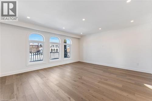 Unfurnished room featuring light wood-style floors, crown molding, and recessed lighting - 16 Bosna Court, Hamilton, ON - Indoor Photo Showing Other Room