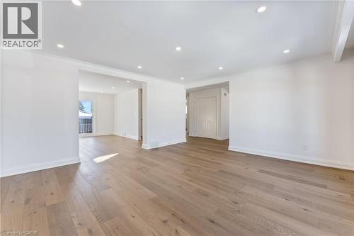 Unfurnished room featuring light wood-type flooring, crown molding, and recessed lighting - 16 Bosna Court, Hamilton, ON - Indoor Photo Showing Other Room