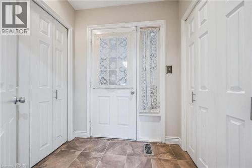 closet on left housed original laundry appliances. Door to garage. 2 closets - 3012 First Street, Burlington, ON - Indoor Photo Showing Other Room
