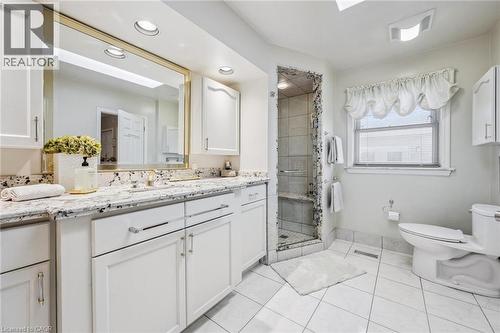 Separate shower and tub. High vanity. Skylight. - 3012 First Street, Burlington, ON - Indoor Photo Showing Bathroom